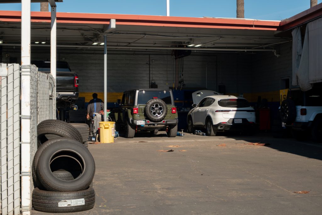 Tustin CDJR Full-Service Department Vehicles being serviced in the open service bays at