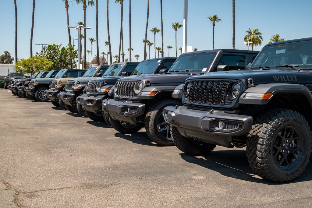 Tustin CDJR dealership exterior Exterior of Tustin Chrysler Dodge Jeep Ram dealership with a front row of facing jeep wranglers